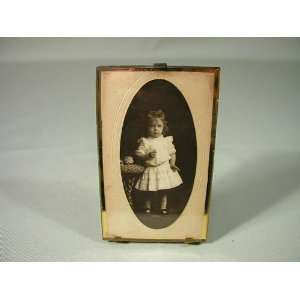  Picture of a small girl with a handcrafted frame
