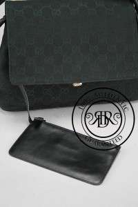 Signature monogram canvas body Rolled leather strap Flap closure with 