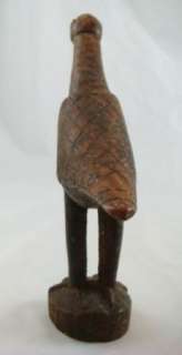 Unsigned wood carved bird with careful notched feathers and diamond 