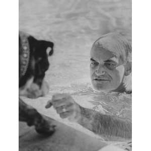  Arizona Senator Barry Goldwater Playing with His Dog While 