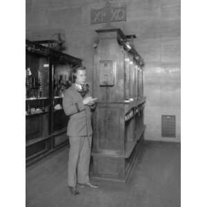 1928 photo Telephone operator at booth, new quotation system, New York 